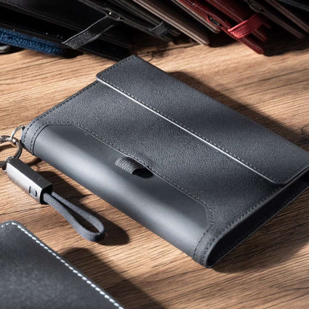 Compact passport organizer with built-in power bank for international travel